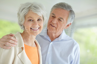 Buy stock photo Elderly couple, love and portrait with smile in home for support, retirement and romantic connection. Happy, senior man and woman with care in house for marriage, bonding or peace on weekend together