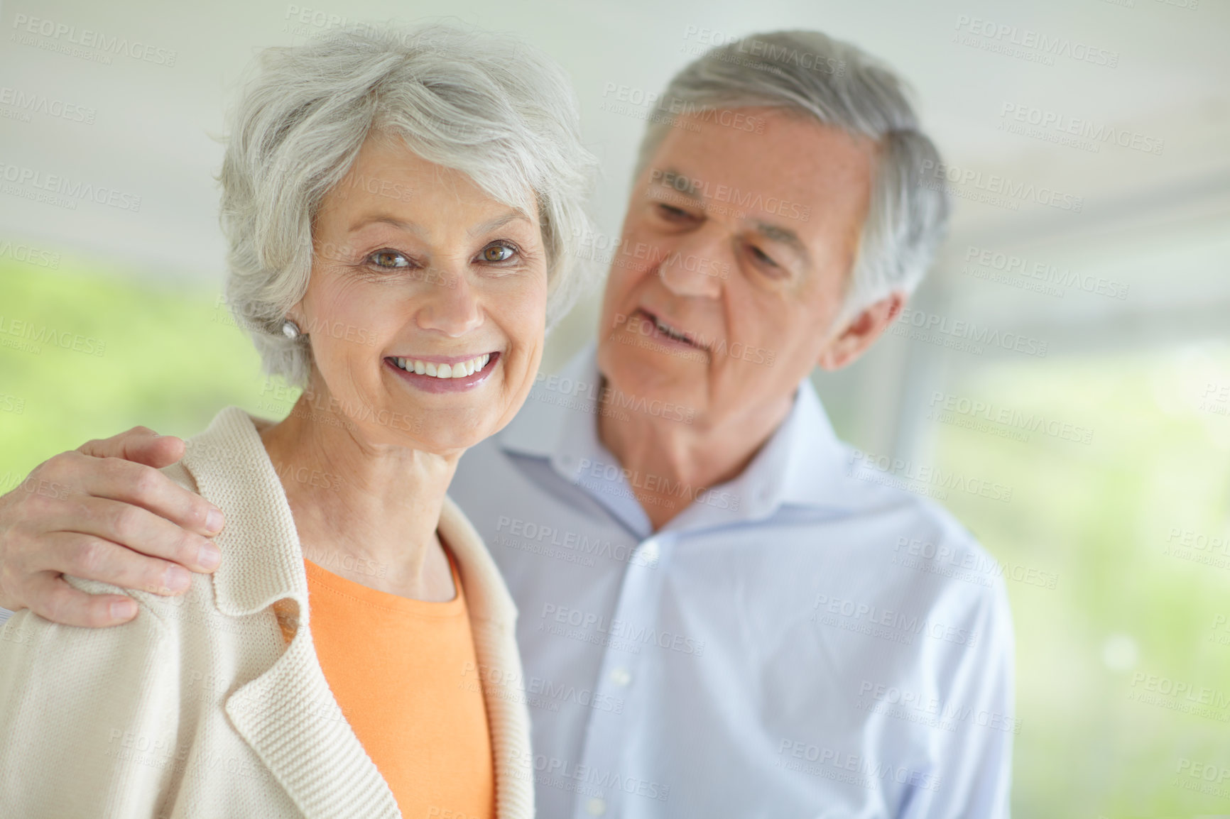 Buy stock photo Elderly couple, love and portrait with smile in home for support, retirement and romantic connection. Happy, senior man and woman with care in house for marriage, bonding or peace on weekend together