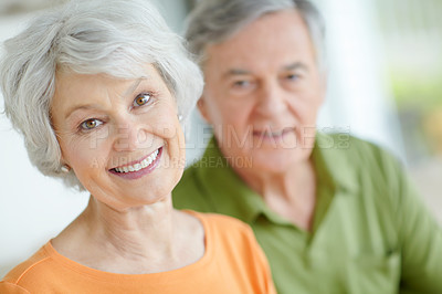 Buy stock photo Senior couple, relax and portrait with smile in home for retirement, connection and romantic bonding. Elderly woman, man and face with support in house for peace, marriage or love on weekend together