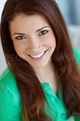 Buy stock photo Portrait of an attractive young woman sitting at home