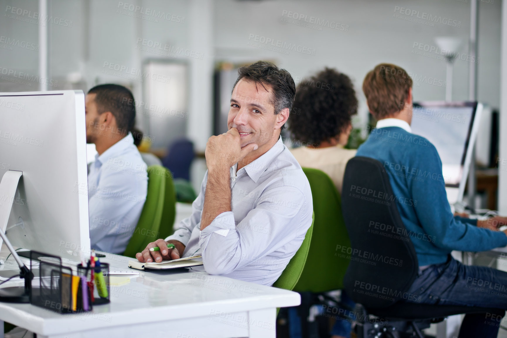 Buy stock photo Businessman, office and portrait with smile at desk with notebook for confidence with technology. Employee, team and financial management services for clients in company with tax preparation.