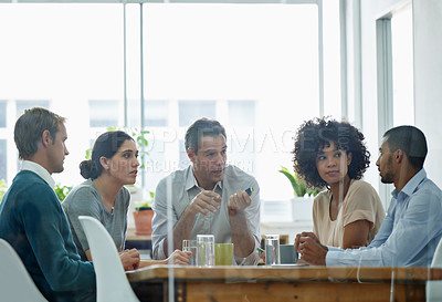Buy stock photo Cropped shot of a group of colleagues in a business meeting