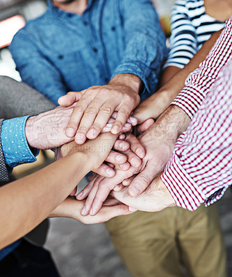 Buy stock photo Diverse business people stack hands together showing support, teamwork and motivation or success for a project in the office. Group of colleagues cooperate and celebrate success after a meeting