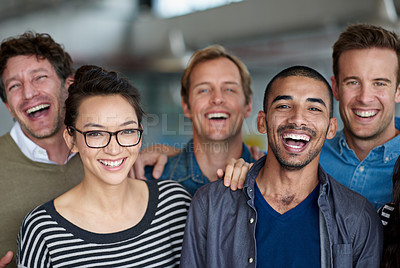 Buy stock photo Excited group of creative professionals smiling and laughing for a group shot