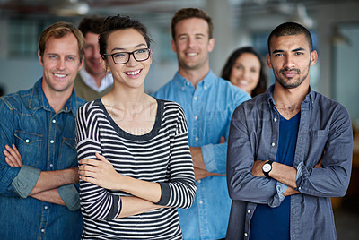 Buy stock photo Group of creative professional smiling at the camera with their arms crossed