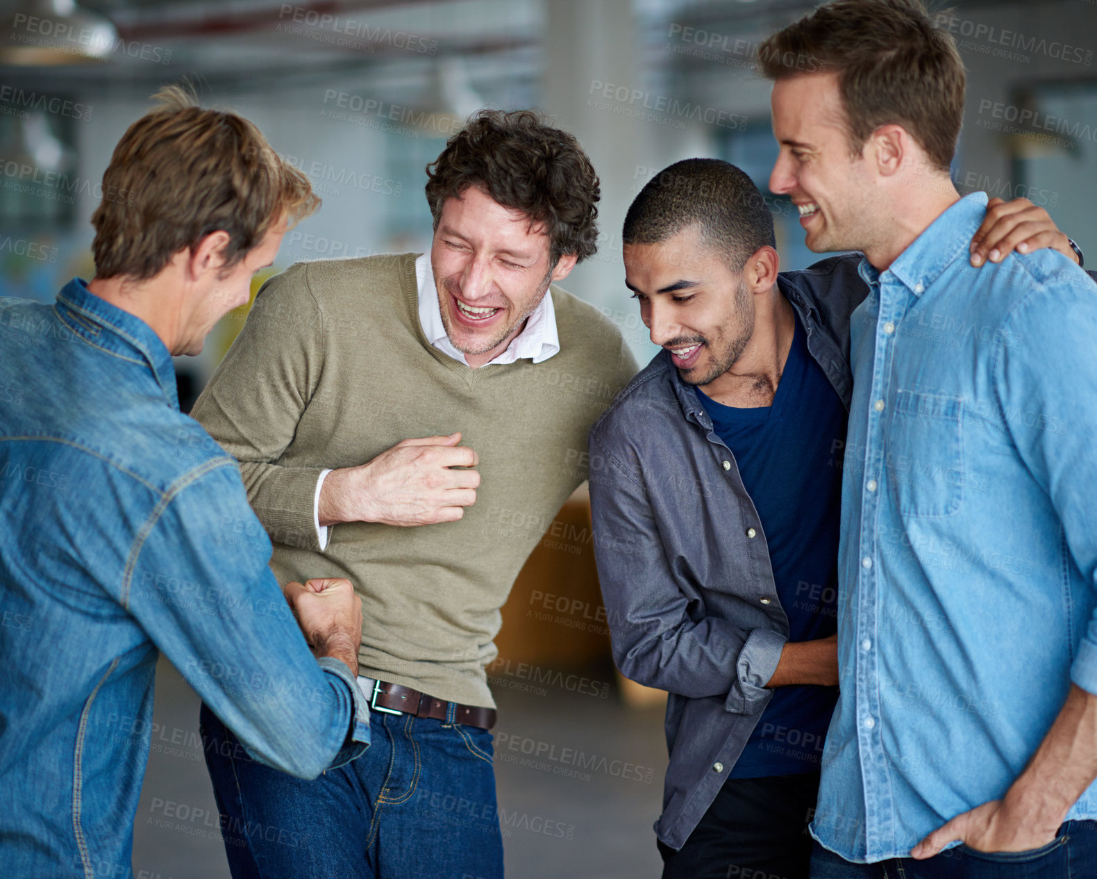 Buy stock photo Group of male coworkers messing about and having a laugh