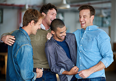 Buy stock photo Male colleagues joking with each other in the office