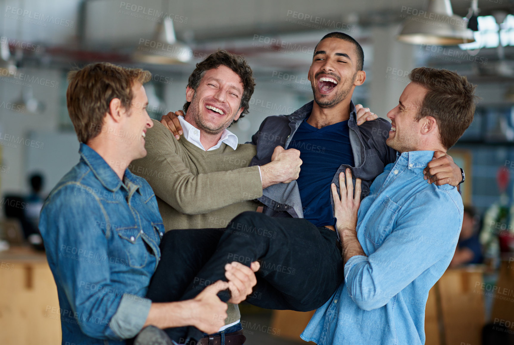 Buy stock photo Group of male coworkers messing around and being silly in the office