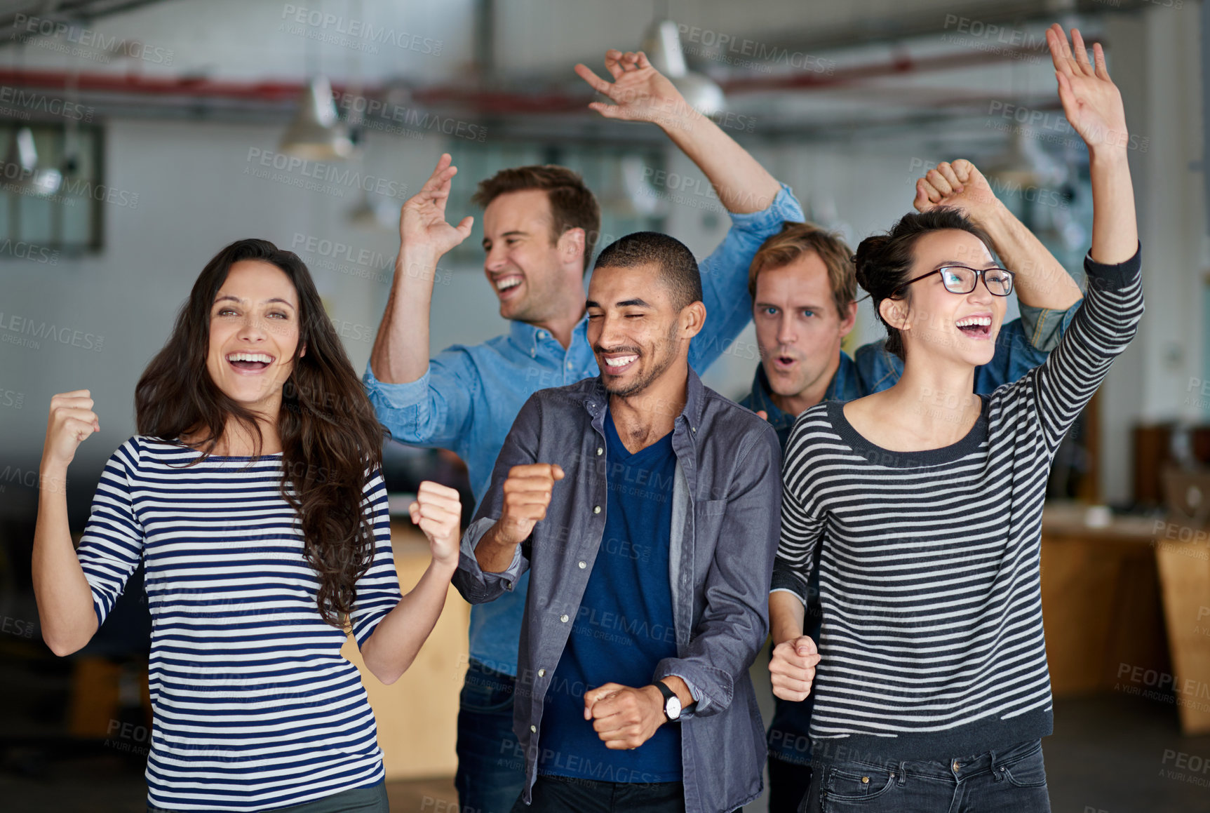 Buy stock photo Group of office staff shouting and dancing together in their office