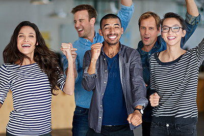 Buy stock photo Diverse group of positive staff members celebrating together in their office
