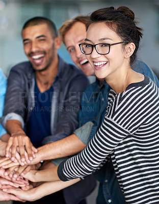 Buy stock photo Friendly group of staff putting their hands together