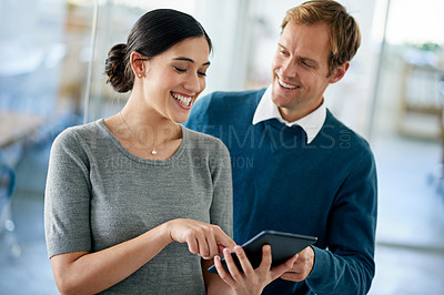 Buy stock photo Woman, man and tablet with discussion in office, smile and point for decision, collaboration and planning. Business people, digital touchscreen and mentor with advice, creativity and ideas at startup