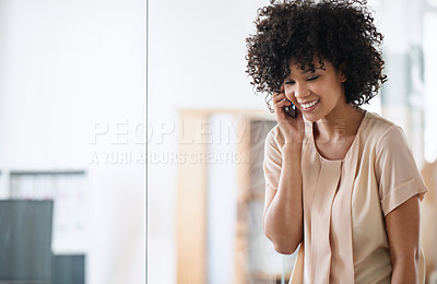 Buy stock photo Shot of a beautiful young businesswoman talking on her cellphone in the office