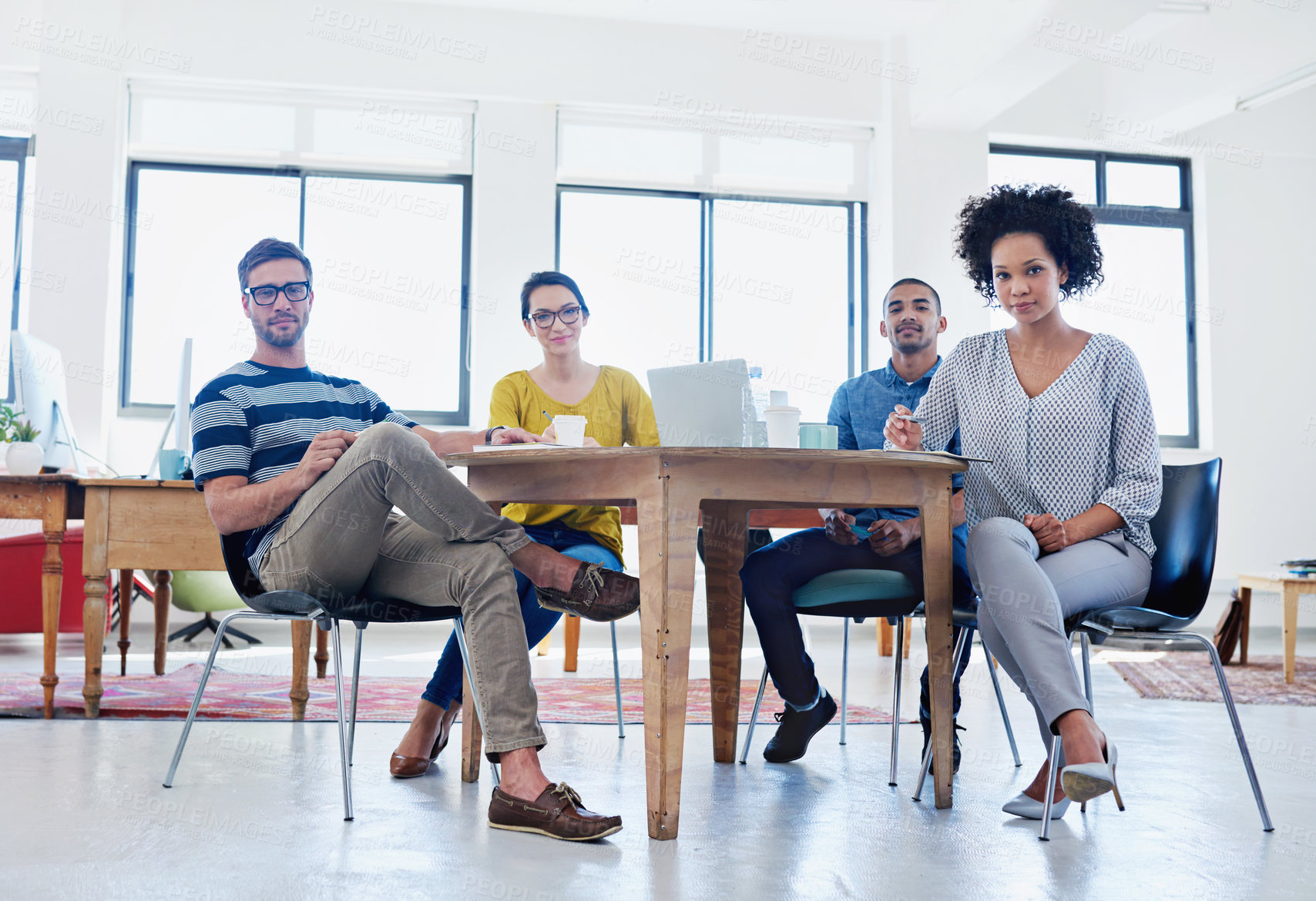 Buy stock photo Portrait of a group of young designers at work in an office