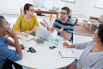 Buy stock photo Shot of a group of young designers at work in an office