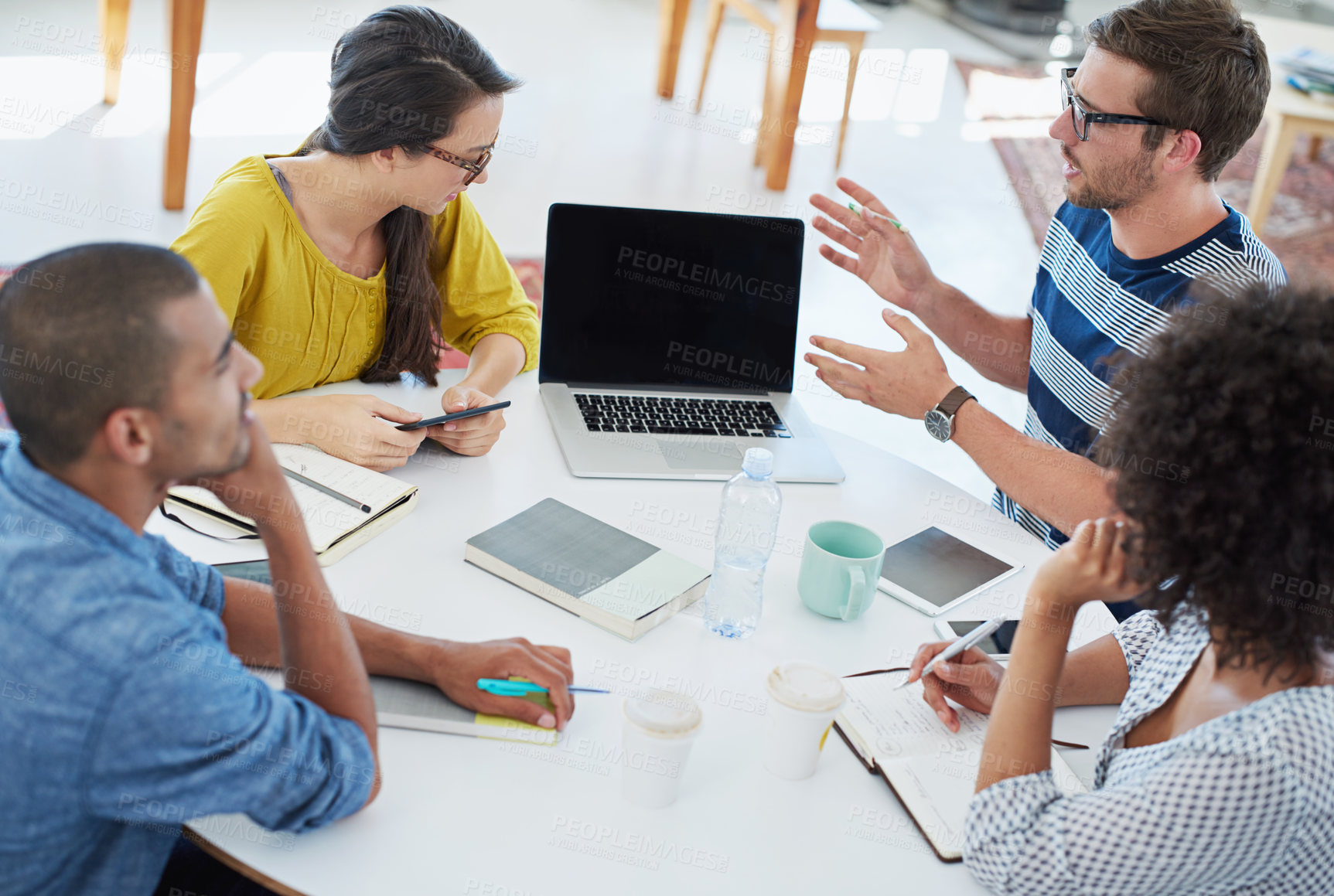 Buy stock photo Laptop, brainstorming and team of creative business people in meeting for startup idea discussion. Diverse group, collaboration and project strategy for training or copywriter planning on computer