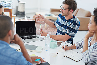 Buy stock photo Shot of a group of young designers at work in an office