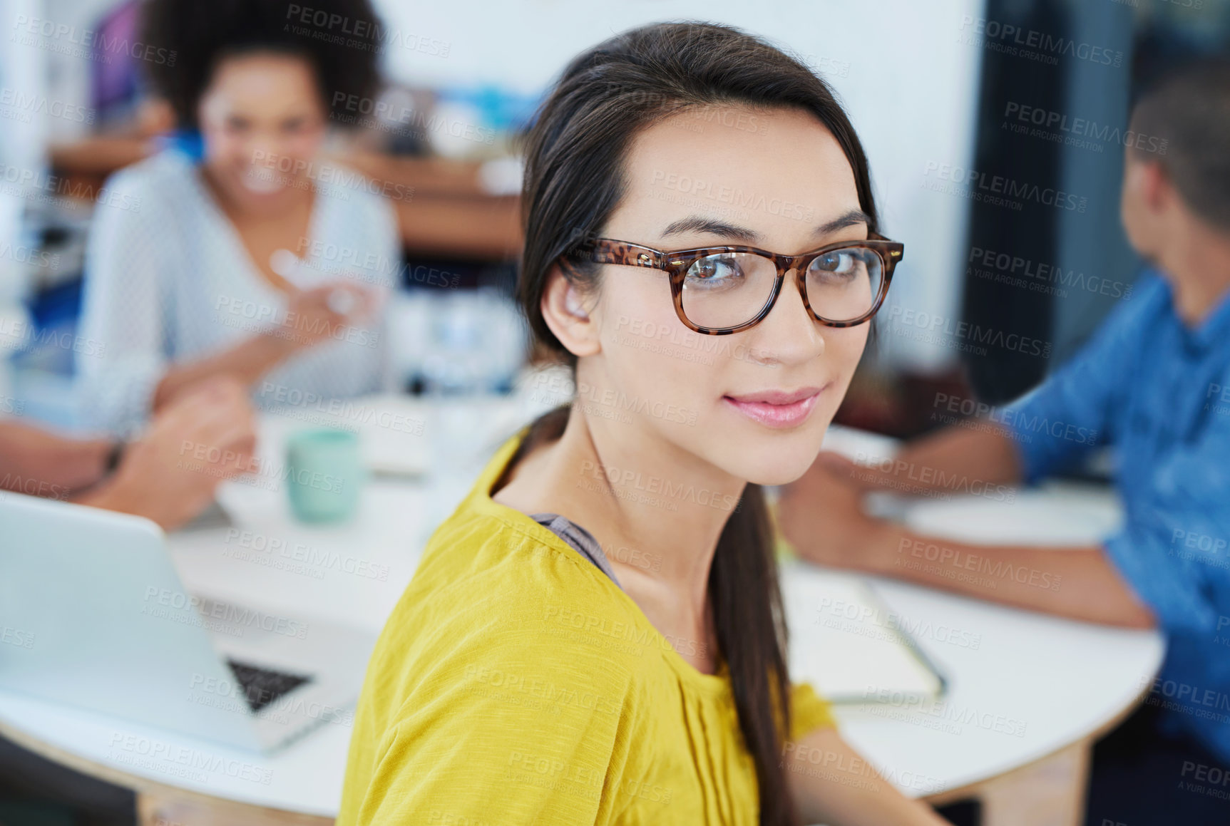 Buy stock photo Portrait of a young office worker with colleagues in the background