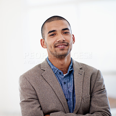 Buy stock photo Shot of a young man standing in an office