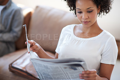 Buy stock photo Newspaper publication, woman and reading on sofa for knowledge, article or information on stock market in living room. Story, trending and female person for global events, newsletter or print in home