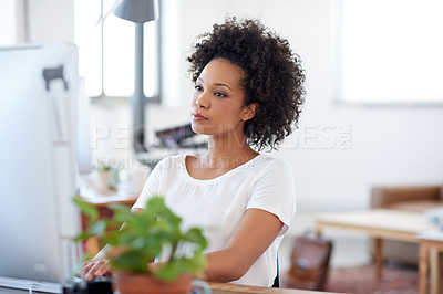 Buy stock photo Confident woman working at her desk in an open office space