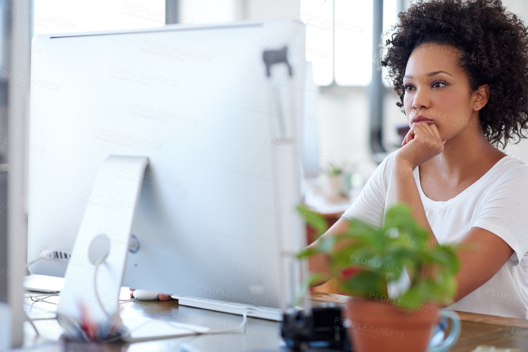 Buy stock photo Confident woman working at her desk in an open office space