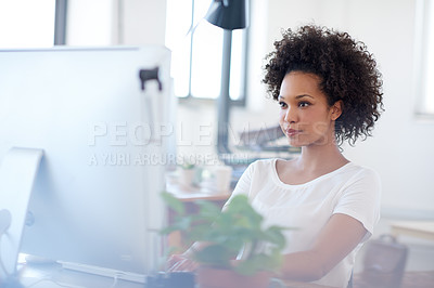Buy stock photo Confident woman working at her desk in an open office space