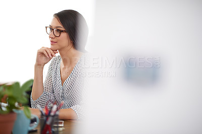 Buy stock photo Young woman working at her desk