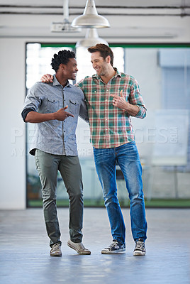 Buy stock photo Two male friends chatting wth their arms round each other laughing and smiliing