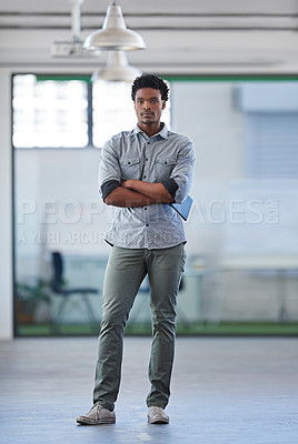 Buy stock photo Full length portrait of a handsome African man in an open office space