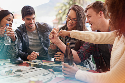 Buy stock photo Friends with beer, drinking and hands together in pub, restaurant outdoors and reunion on weekend. People, men and women with social gathering, celebration and alcohol with happiness or joy 