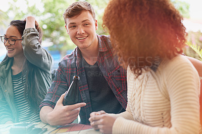 Buy stock photo Outdoor, friends and beer with conversation, smile and communication with social gathering. Restaurant, man and women with alcohol or drinking with discussion or happiness with party or weekend break