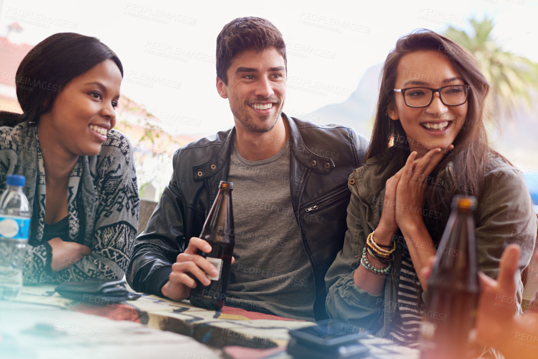 Buy stock photo Friends with beer, outdoor and laughing in pub, restaurant or drinking and reunion on weekend. People, man and women with social gathering together, celebration and alcohol with happiness or joy 