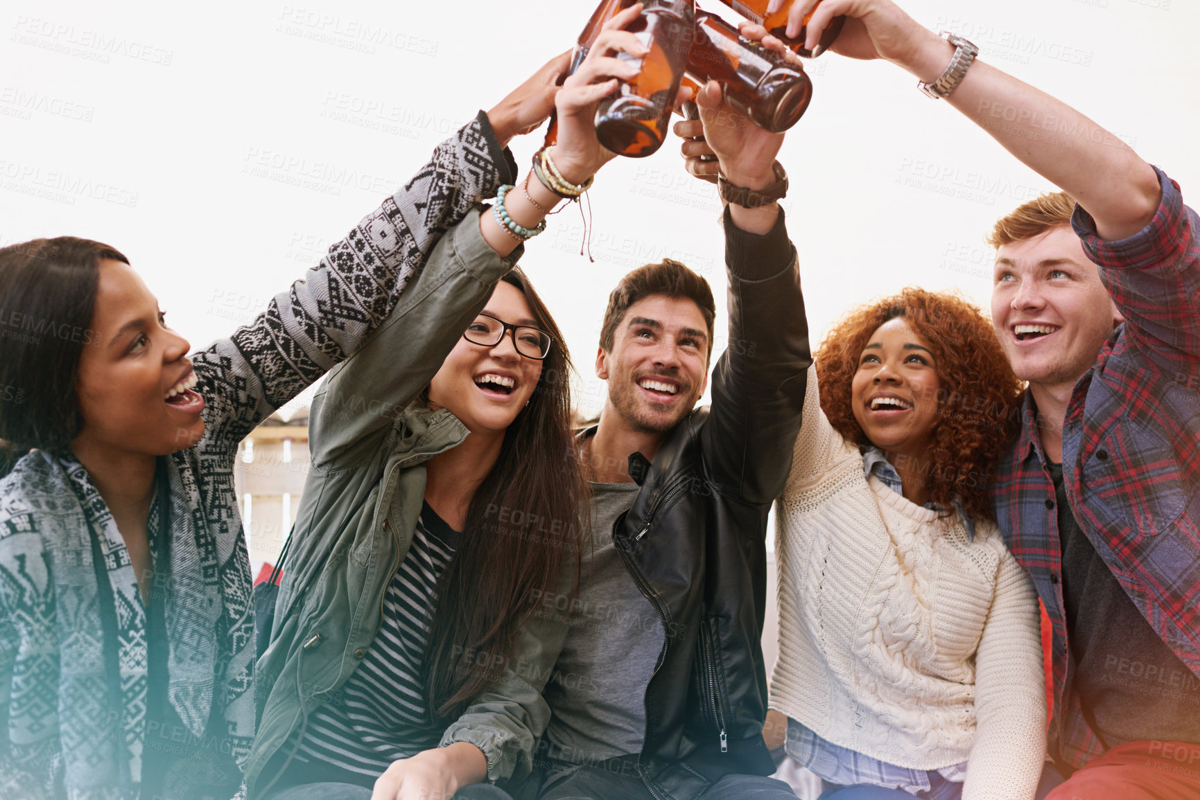 Buy stock photo Friends, beer and cheers for celebration outdoor, bonding and fun with people drinking at party, social event or gathering. Happy, toast for success or achievement, support and trust with alcohol