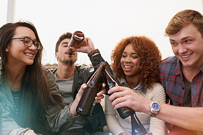 Buy stock photo Cropped shot of a group of friends drinking outdoors