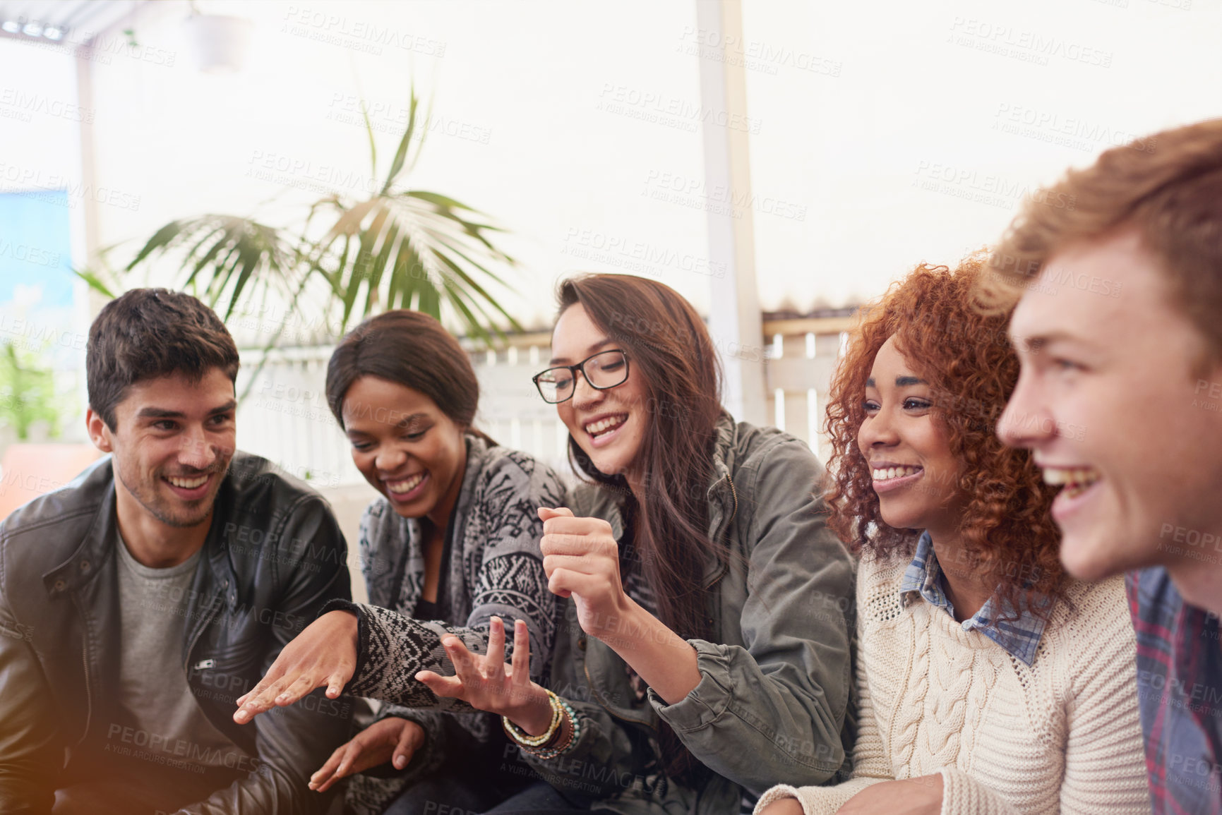 Buy stock photo Friends, comedy and happy together outdoor, relax at restaurant for bonding and reunion with laughing. Funny story, catch up and social gathering with support, trust and care in friendship group