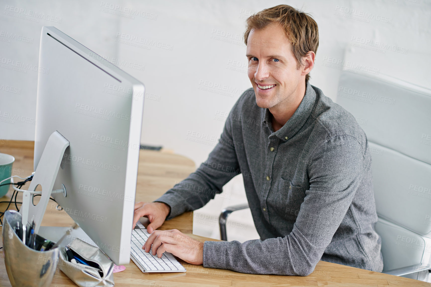 Buy stock photo Portrait, entrepreneur and man with keyboard in office, computer and internet for email, proposal and deal. Designer, desktop and person in business, online and digital for website and creative