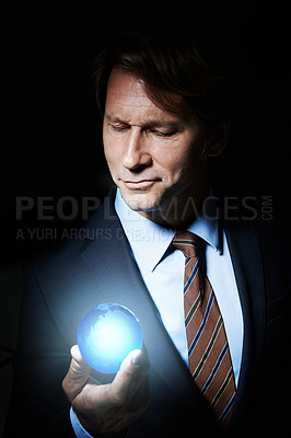 Buy stock photo Globe, business man and hologram for networking, communication or globalization in studio with black background. World, innovation and male person for connection, development and information