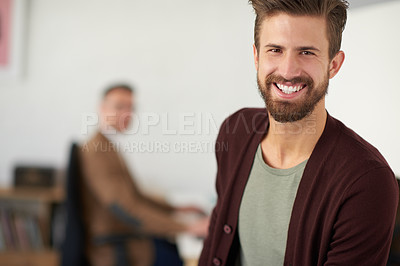 Buy stock photo Portrait of a handsome businessman working in his office