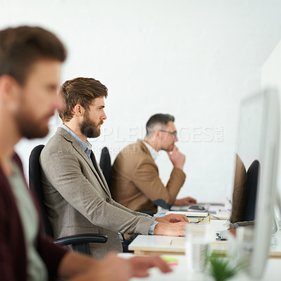 Buy stock photo Coworking, row and businessman in office on computer for copywriting, editing or creative agency for media. Startup, news and journalist typing on pc for publication website or reading blog update