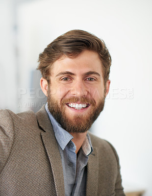 Buy stock photo Portrait of a handsome businessman working in his office