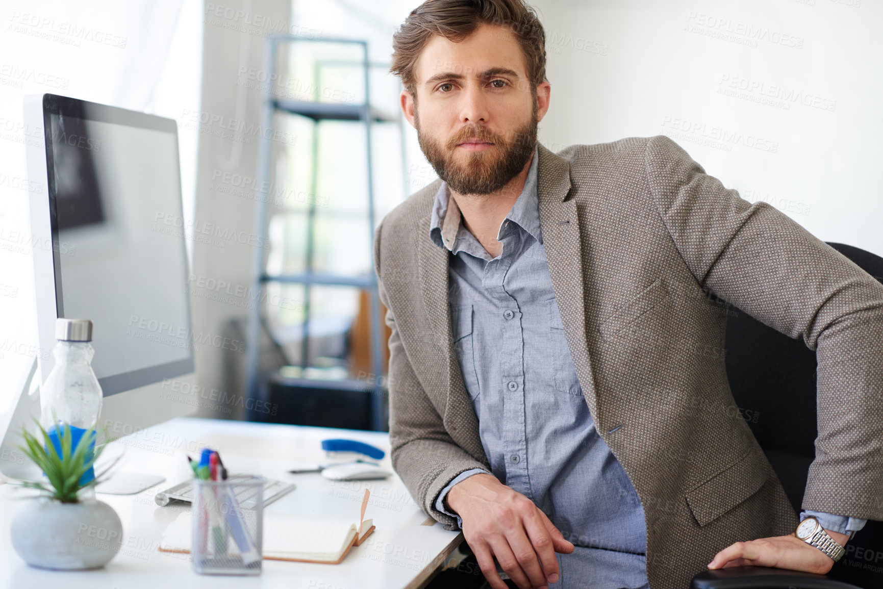 Buy stock photo Portrait, serious and man in office, computer and writer with confidence, working and desk. Project, face and person with pride, ambition and employee in media agency, deadline and  journalist