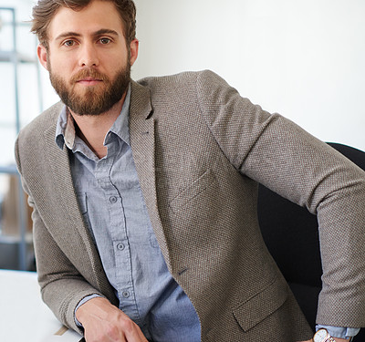 Buy stock photo Portrait of a handsome businessman working in his office