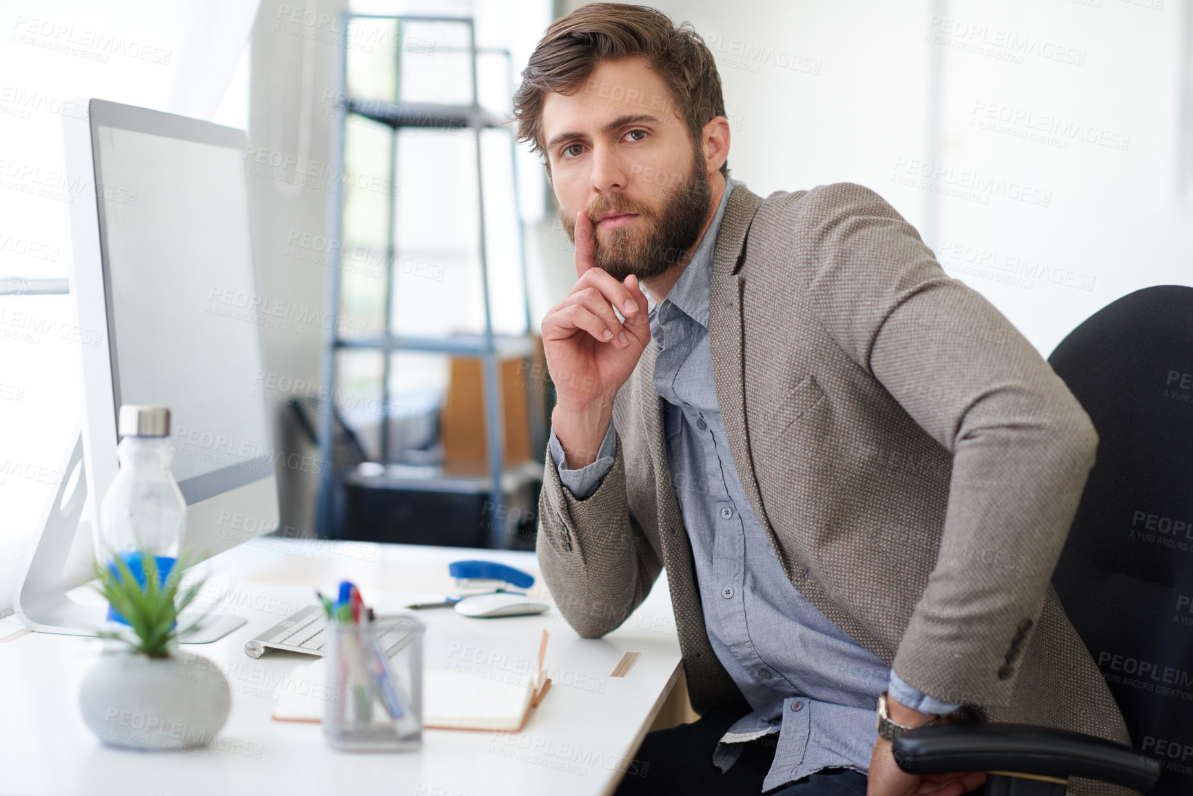 Buy stock photo Portrait of a handsome businessman working in his office