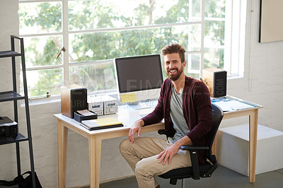 Buy stock photo Portrait of a handsome businessman working in his office