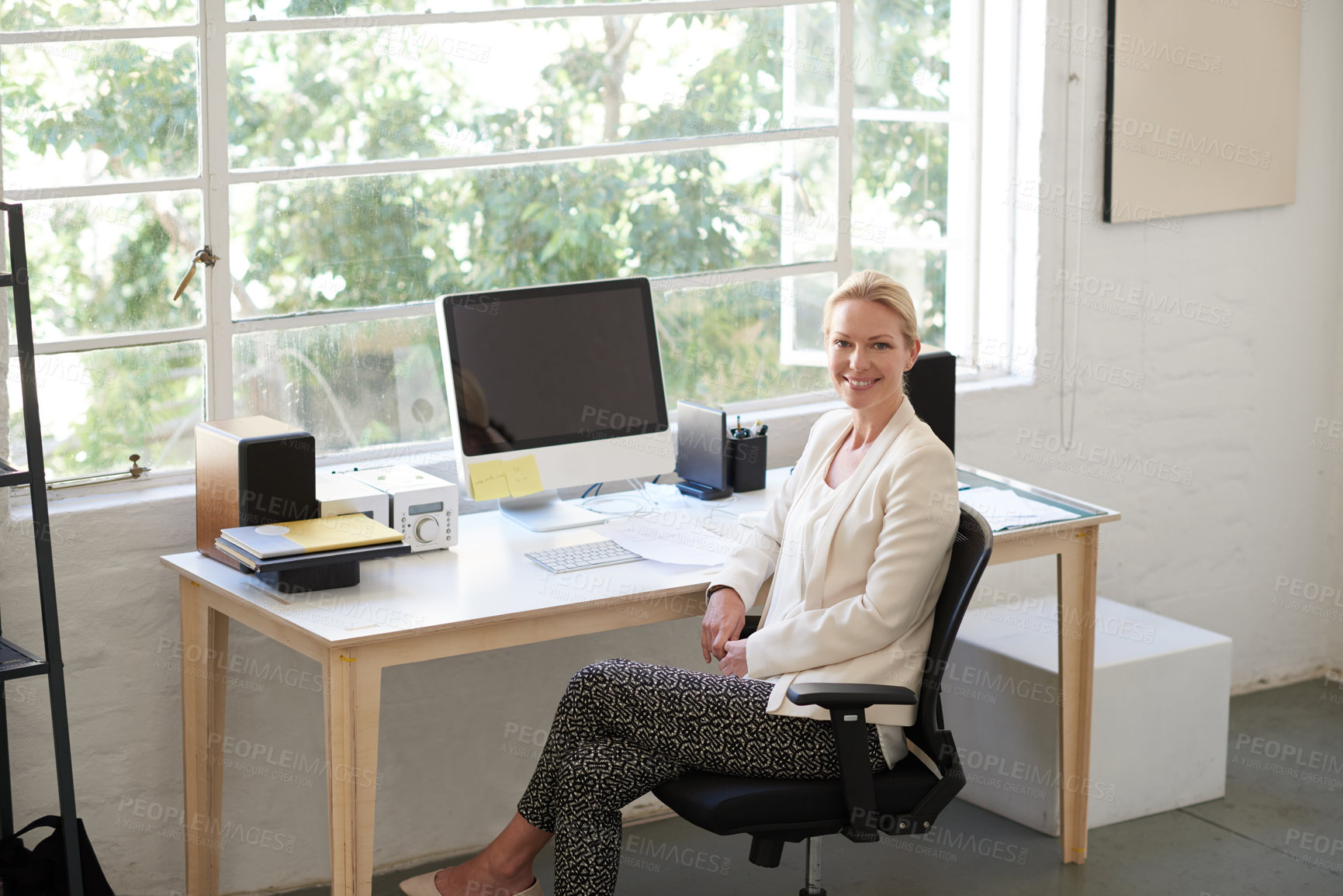 Buy stock photo Employee, woman and smile in office with computer for career and job growth as human resources. Workplace, female person and happy or proud with startup company, business and opportunity on portrait