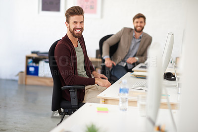 Buy stock photo Businessman, joy and portrait in office, table and coworking of colleagues, computer and together. Face, working and entrepreneur in company, journalist and confidence in startup and creative