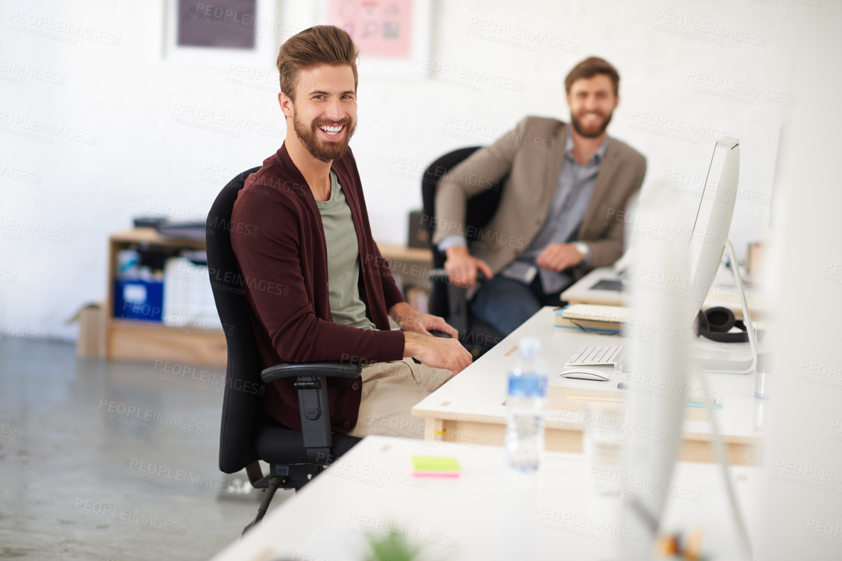 Buy stock photo Businessman, joy and portrait in office, table and coworking of colleagues, computer and together. Face, working and entrepreneur in company, journalist and confidence in startup and creative