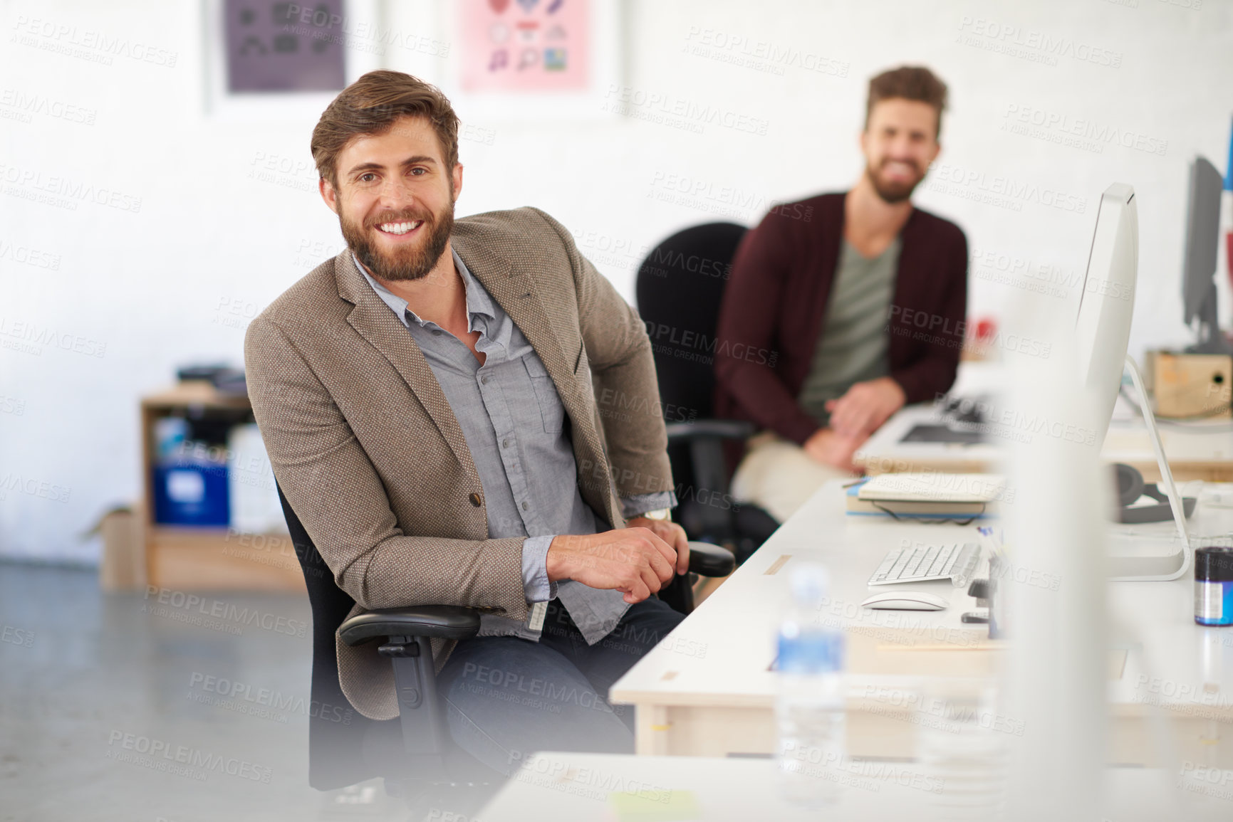 Buy stock photo Businessman, writer and portrait in office, joy and coworking of colleagues, computer and together. Face, working and entrepreneur in company, journalist and creative with confidence and table