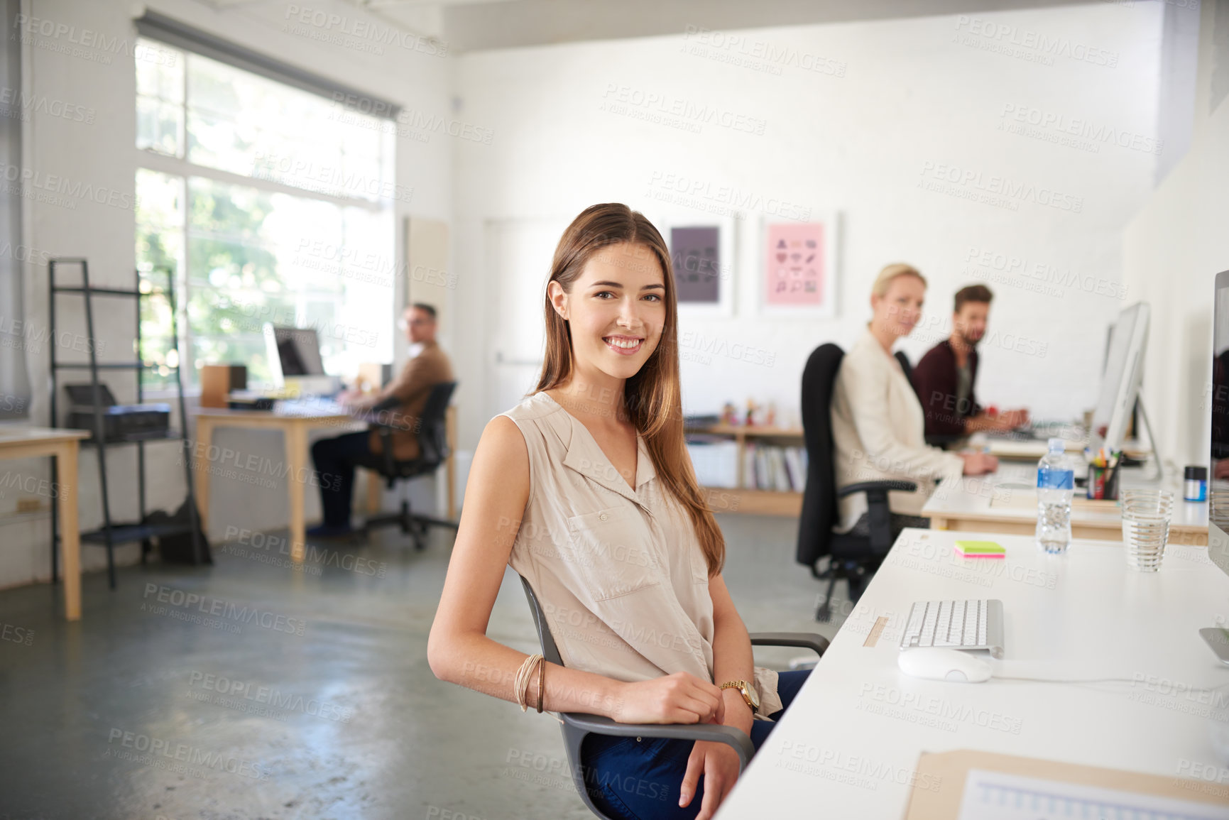 Buy stock photo Businesswoman, writer and portrait in office, smile and coworking of colleagues, computer and together. Face, happy and entrepreneur in company, journalist and creative with confidence and table